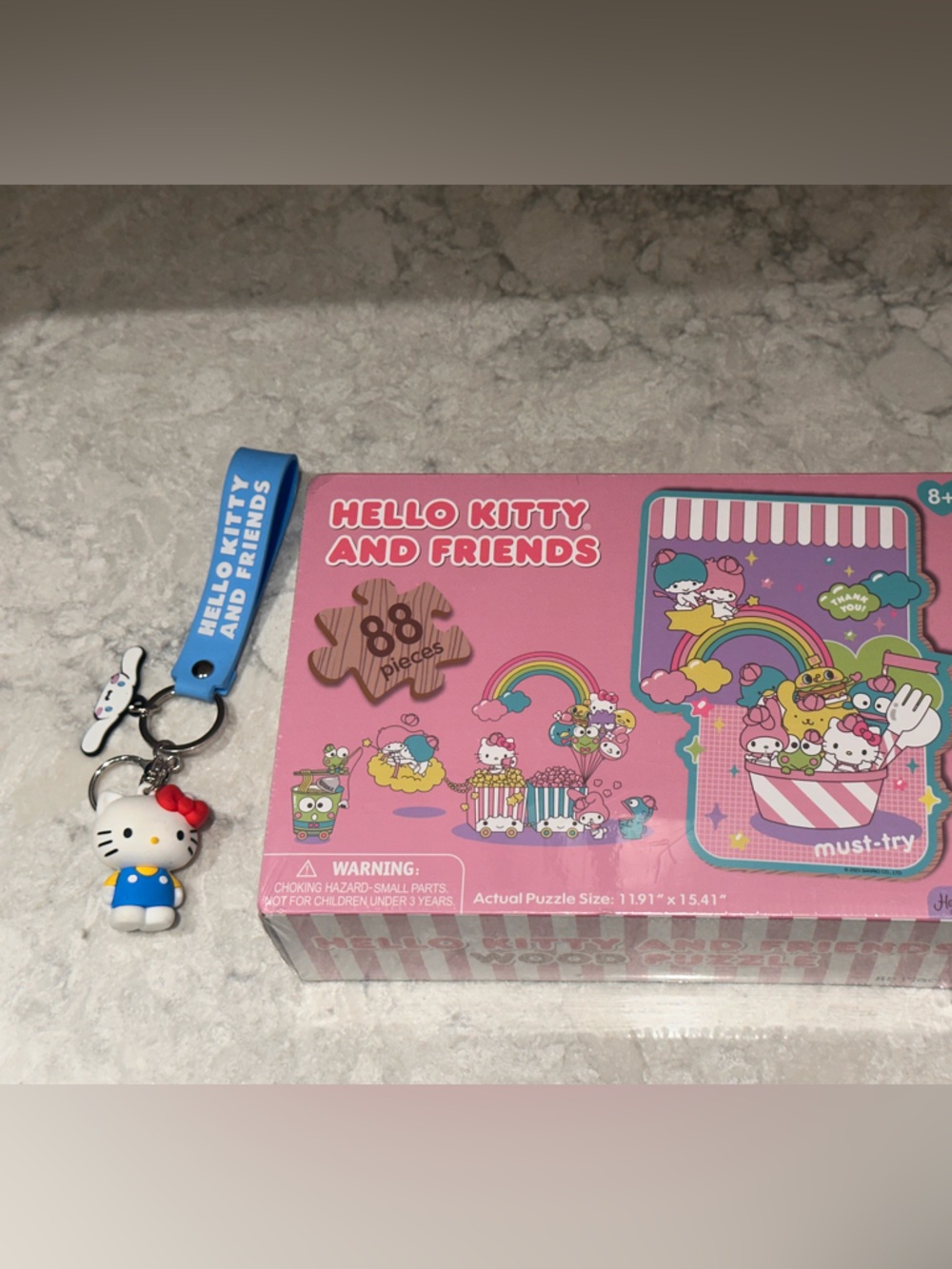 Hello Kitty Pink Puzzle with Blue Keychain Charm
